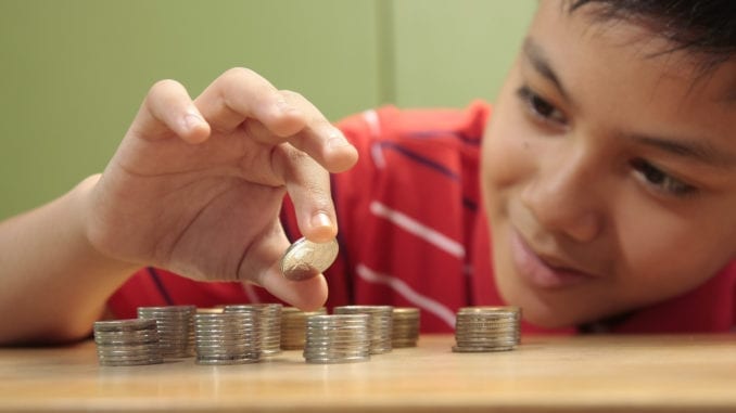 Boy and a Pile of Coins