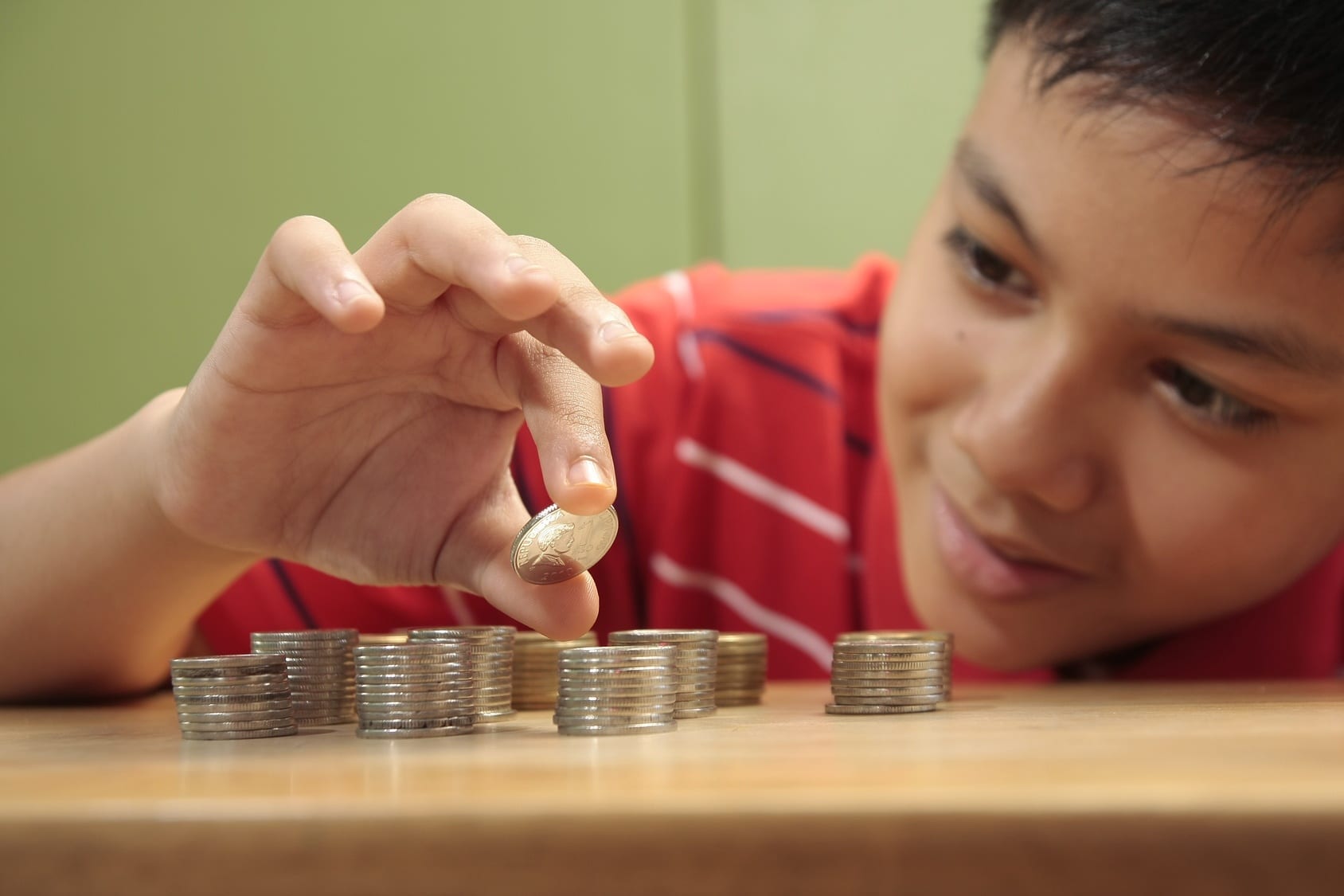 Boy and a Pile of Coins